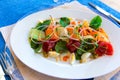 Fish salad with marinated tuna, smoked salmon, vegetables and red caviar Royalty Free Stock Photo