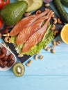 Fish salmon salad omega 3 avocado on blue wooden background healthy food Royalty Free Stock Photo