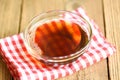Fish sauce on glass bowl and wooden background, fish sauce obtained from fermentation fish or small aquatic animal, fermented Royalty Free Stock Photo