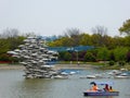 Fish sculpture and boat on a lake at Shanghai flower port