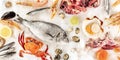 Fish and seafood, a flatlay panoramic shot. Sea bream, shrimps, crab etc