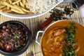 Fish and seafood stew, rice, beans and chips, Moqueca typical Brazilian meal, top view