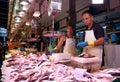 Fish seller in La Boqueria Market in Barcelona, Spain