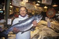 Fish seller at Salmon stand at Pike Place Public Farmers Market, Seattle, WA Royalty Free Stock Photo