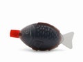 Fish shaped plastic takeaway container serving of soy sauce isolated on a white background Royalty Free Stock Photo