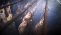 Fish smoked on hooks in smokehouse Royalty Free Stock Photo