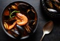 Fish soup bouillabaisse. Mussels and shrimp in tomato sauce. The traditional dish of Marseilles. Rustic style. Royalty Free Stock Photo