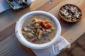 Fish soup in a cardboard bowl with a piece of rye bread served in herring market Royalty Free Stock Photo