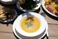 Fish soup dish from red scorpionfish, bread, greens salad in the greek tavern, healthy seafood lunch concept.