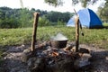 Fish soup preparation on a fire in a cauldron Royalty Free Stock Photo