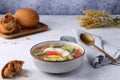 Fish soup Ukha from zander, with pieces of fish, with potatoes, leeks and peeled tomatoes,
