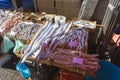 Local people and tourists buying fresh fish on a fish market