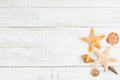 Fish star and sea shells on the wooden background Royalty Free Stock Photo