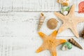 Fish star and sea shells on the wooden background Royalty Free Stock Photo