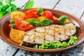 Fish steak grilled vegetables Royalty Free Stock Photo
