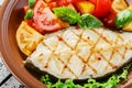 Fish steak grilled vegetables Royalty Free Stock Photo