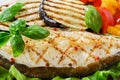 Fish steak grilled vegetables Royalty Free Stock Photo