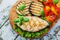 Fish steak grilled vegetables Royalty Free Stock Photo