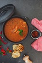 Fish stew with tomatoes in cast iron pot Royalty Free Stock Photo