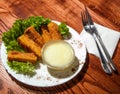 Fish sticks with salad on a white plate Royalty Free Stock Photo