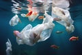 Fish swimming around plastic bags in clear blue ocean water Royalty Free Stock Photo