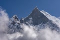 Fish Tail Summit also Machapuchare surrounded by rising clouds Royalty Free Stock Photo