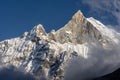 Fish Tail Summit also Machapuchare surrounded by rising clouds, Himalayas Royalty Free Stock Photo