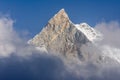 Fish Tail Summit Machapuchare surrounded by rising clouds in Himalayas Royalty Free Stock Photo