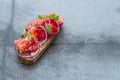 Fish Tapas on Crusty Bread, bread and cured salmon Royalty Free Stock Photo