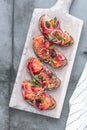 Fish Tapas on Crusty Bread, bread and cured salmon Royalty Free Stock Photo
