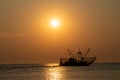 A fish trawler in the North Sea, Waddenzee at sunset