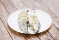 Fish trout dish with lemons on a white plate. Royalty Free Stock Photo