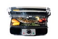 Fish and vegetables on electric grill Royalty Free Stock Photo