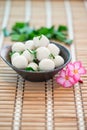 Fishballs in bowl on the bamboo floor.