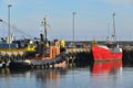 Fishboat and tug in a harbor Royalty Free Stock Photo