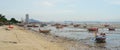 Fisheman boat moor at low tide sea