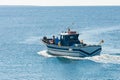 Fisher boat in action at sea