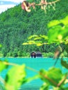 Fisher boat house and wooden hut with pier in the shore of Walchensee lake Royalty Free Stock Photo