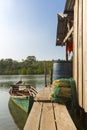 Fisher boat near by wooden house on Ko Rong Island, Cambodia Royalty Free Stock Photo