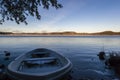 Fishing boat at sunrise at Inari lake, Finland Royalty Free Stock Photo