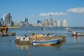 Fisher boats near fish market in Panama City with skyline background Royalty Free Stock Photo