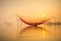 Fisher check net on Hoai river in ancient Hoian town in Vietnam.