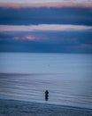 Fisher fishing in Brittany in France at dusk