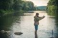 Fisher fishing equipment. Handsome man relaxing. Leisure on lake. Set up rod with hook line sinker. Bearded fisher in