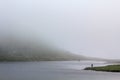 Fisher fishing in the Horntjerni lake river on VeslehÃÂ¸dn, Norway