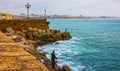 Fisher on Kadiz sea front, Spain