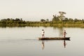 Fisher man fishing from his boat at the time of sunset. Royalty Free Stock Photo