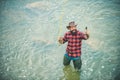 Fisher man fishing with spinning reel. Fly fishing is most renowned as a method for catching trout and salmon. Royalty Free Stock Photo