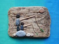 Fisher mans picture using sea wood, stones and glass, Lithuania