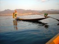 A fisher is preparing his trap